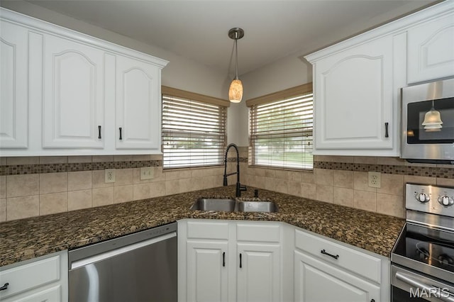 403 Autumn Farms Ct, Wentzville, MO 63385 - kitchen with stainless steel appliances, white cabinets, and backsplash