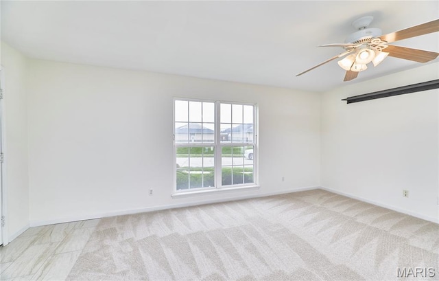 9 Homefield Gardens Dr Unit 31N, Ofallon, MO 63366 - spare room with a ceiling fan, baseboards, and light colored carpet