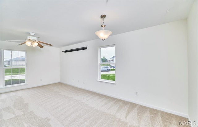 9 Homefield Gardens Dr Unit 31N, Ofallon, MO 63366 - unfurnished room with plenty of natural light, light carpet, and baseboards