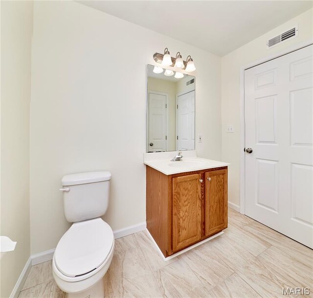 9 Homefield Gardens Dr Unit 31N, Ofallon, MO 63366 - bathroom with vanity, toilet, baseboards, and marble finish flooring