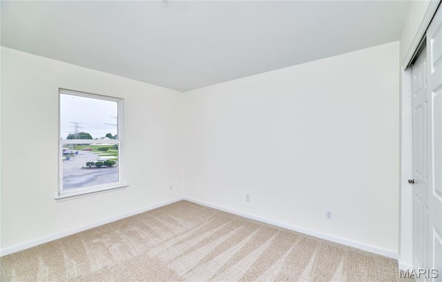 9 Homefield Gardens Dr Unit 31N, Ofallon, MO 63366 - empty room featuring light carpet and baseboards