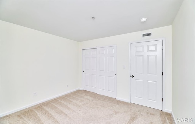 9 Homefield Gardens Dr Unit 31N, Ofallon, MO 63366 - unfurnished bedroom with light colored carpet, baseboards, and a closet
