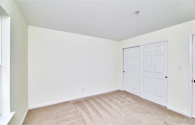 9 Homefield Gardens Dr Unit 31N, Ofallon, MO 63366 - unfurnished bedroom featuring light colored carpet, baseboards, and a closet