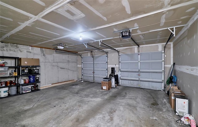 9 Homefield Gardens Dr Unit 31N, Ofallon, MO 63366 - garage featuring a garage door opener