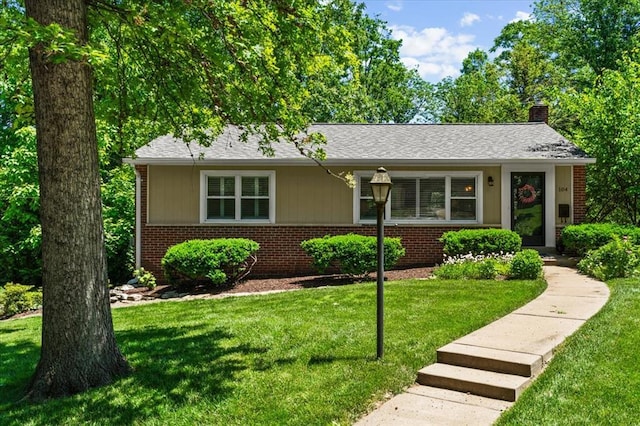 104 S Brent Ave, Oakland, MO 63122 - view of front of property with brick siding, a chimney, and a front yard