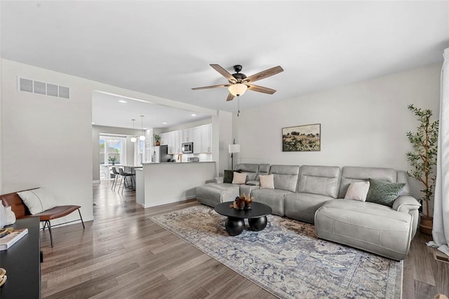 3516 Broad St, Saint Charles, MO 63301 - living room with a ceiling fan, wood finished floors, and recessed lighting