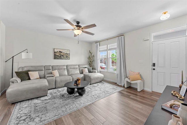 3516 Broad St, Saint Charles, MO 63301 - living area with wood finished floors, ceiling fan, and baseboards