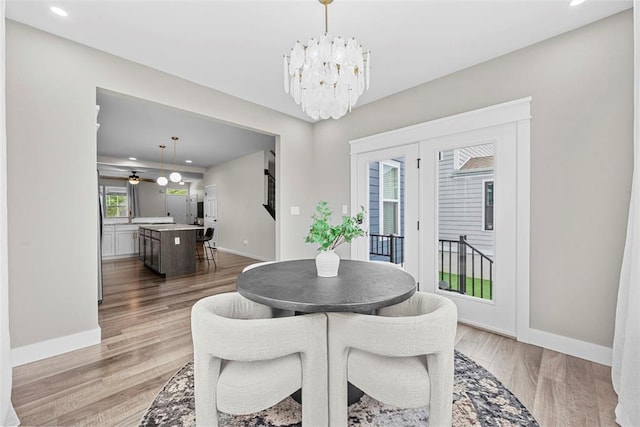 3516 Broad St, Saint Charles, MO 63301 - dining room featuring a chandelier, light wood finished floors, recessed lighting, and baseboards