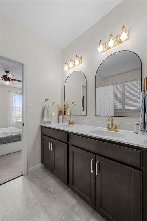 3516 Broad St, Saint Charles, MO 63301 - ensuite bathroom featuring double vanity, ceiling fan, and baseboards