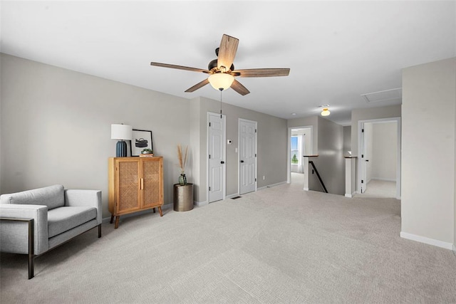 3516 Broad St, Saint Charles, MO 63301 - sitting room featuring an upstairs landing, carpet floors, baseboards, and a ceiling fan