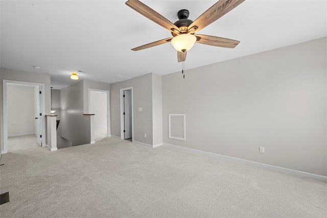 3516 Broad St, Saint Charles, MO 63301 - spare room with a ceiling fan, light carpet, baseboards, and attic access