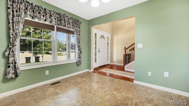 1101 Gulfstream Way, Mascoutah, IL 62258 - entryway featuring stairs, stone finish flooring, and a chandelier