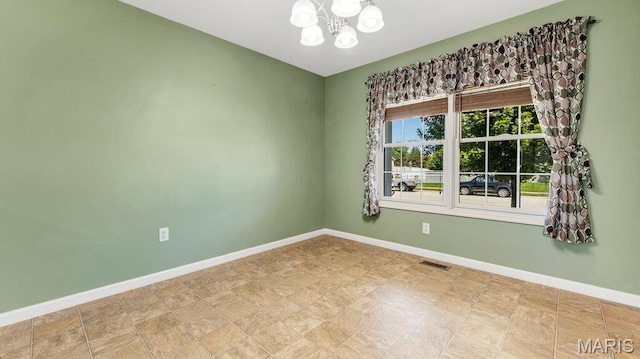 1101 Gulfstream Way, Mascoutah, IL 62258 - spare room with a chandelier and baseboards