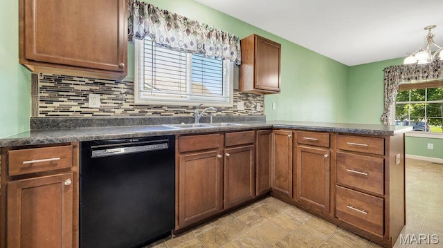 1101 Gulfstream Way, Mascoutah, IL 62258 - kitchen with dishwasher, a peninsula, dark countertops, decorative backsplash, and brown cabinets