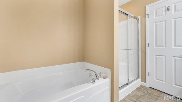 1101 Gulfstream Way, Mascoutah, IL 62258 - bathroom featuring a bath and a stall shower