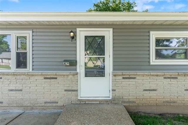 418 Williams St, Pacific, MO 63069 - property entrance featuring brick siding