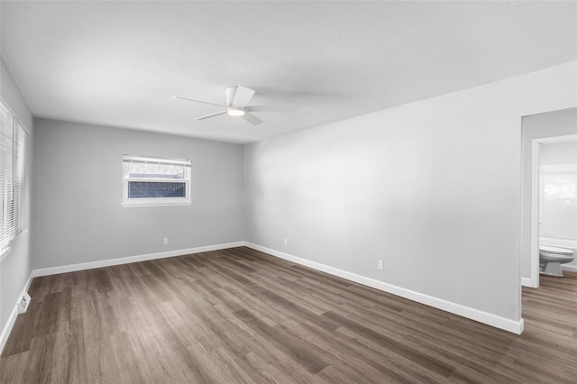 418 Williams St, Pacific, MO 63069 - unfurnished room featuring a ceiling fan, dark wood-style floors, and baseboards