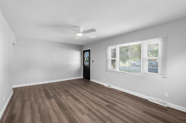 418 Williams St, Pacific, MO 63069 - empty room featuring dark wood-style flooring, baseboards, and ceiling fan