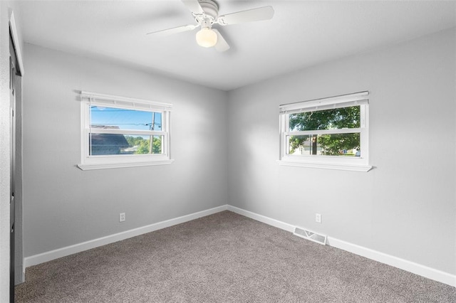 418 Williams St, Pacific, MO 63069 - empty room featuring carpet, baseboards, and a ceiling fan