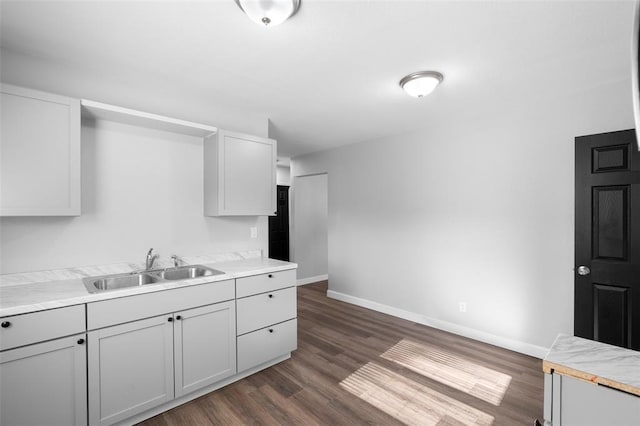 418 Williams St, Pacific, MO 63069 - kitchen with a sink, baseboards, dark wood-style floors, and light countertops