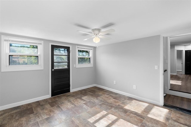 418 Williams St, Pacific, MO 63069 - entrance foyer with ceiling fan, baseboards, healthy amount of natural light, and stone finish floors
