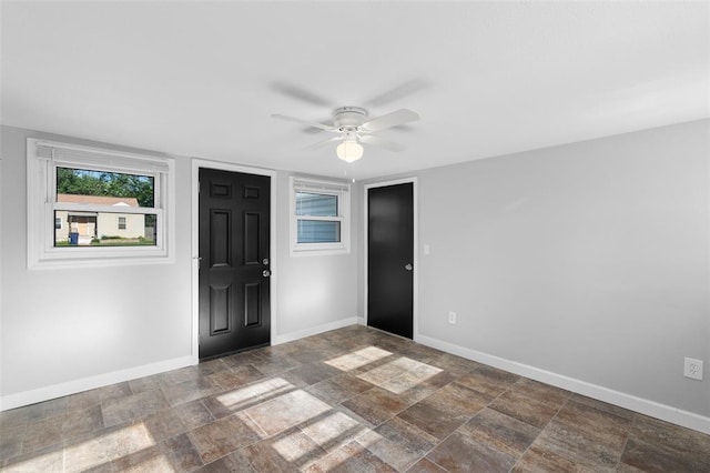 418 Williams St, Pacific, MO 63069 - foyer entrance with baseboards, stone finish floors, and ceiling fan