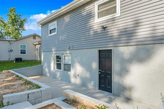 418 Williams St, Pacific, MO 63069 - view of exterior entry featuring cooling unit and stucco siding
