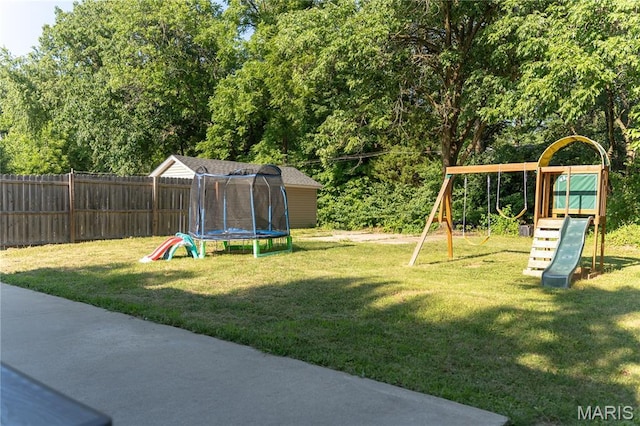 108 Tomlinson St, East Alton, IL 62024 - view of yard with a trampoline and a playground