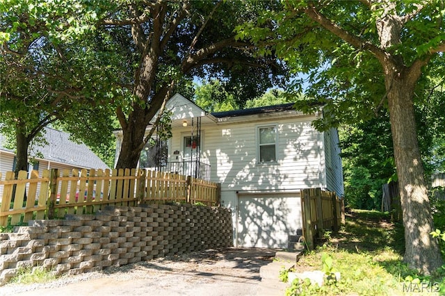 108 Tomlinson St, East Alton, IL 62024 - view of front of house with an attached garage and driveway