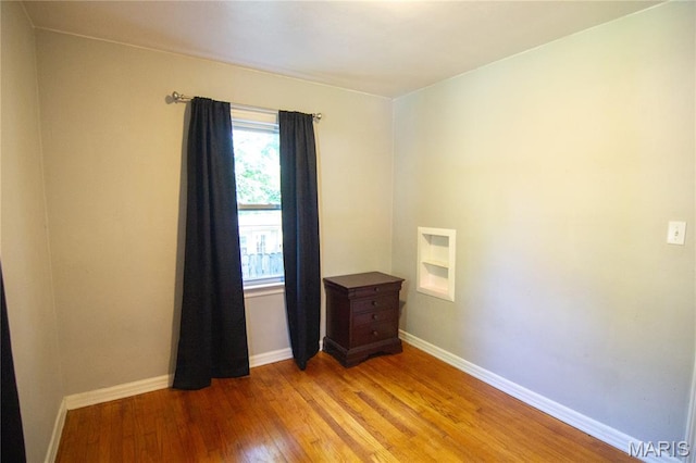 108 Tomlinson St, East Alton, IL 62024 - empty room with light wood-style flooring and baseboards