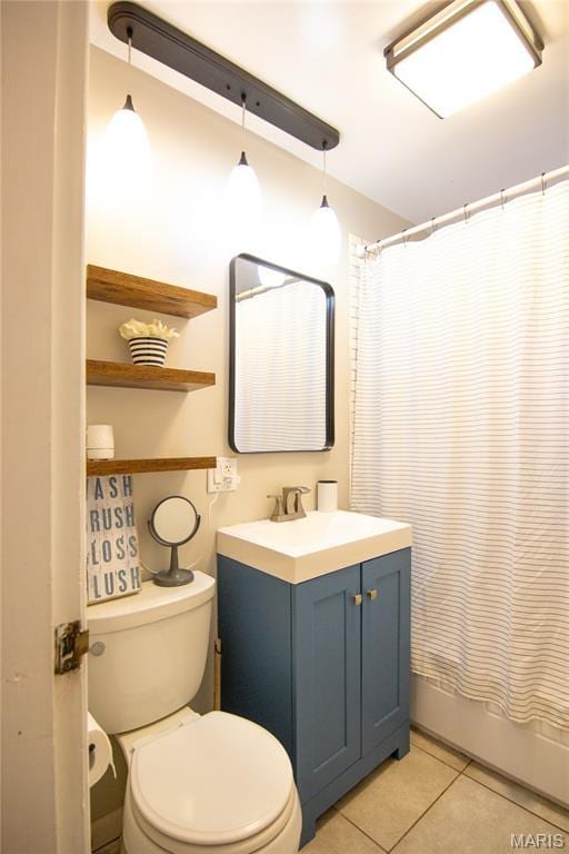 108 Tomlinson St, East Alton, IL 62024 - full bath with vanity, tile patterned flooring, and shower / bath combo with shower curtain