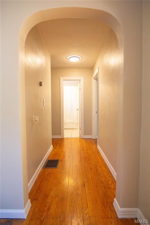 108 Tomlinson St, East Alton, IL 62024 - corridor with arched walkways and light wood-style floors