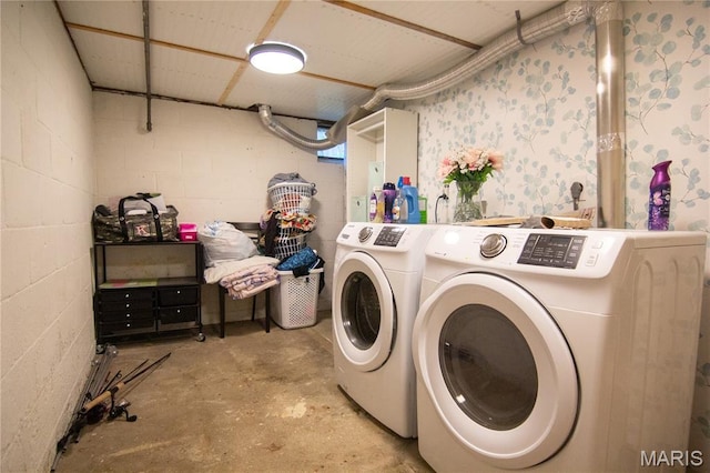 108 Tomlinson St, East Alton, IL 62024 - laundry area with washing machine and dryer and concrete block wall