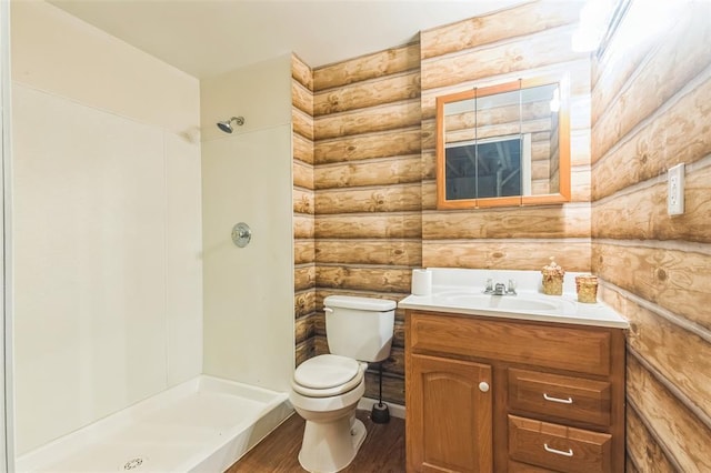 2629 Seminole Rd, Cuba, MO 65453 - full bathroom featuring log walls, toilet, wood finished floors, vanity, and a shower