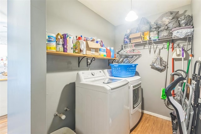 2629 Seminole Rd, Cuba, MO 65453 - washroom with separate washer and dryer, light wood-style flooring, and baseboards