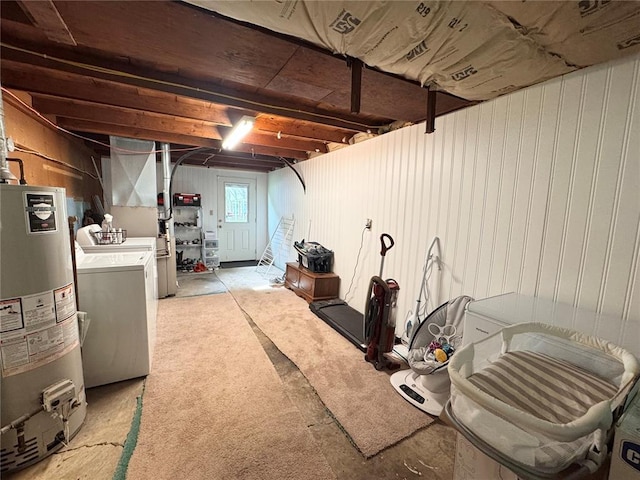 711 N Lindell St, Vandalia, MO 63382 - below grade area with washing machine and clothes dryer, water heater, and light carpet