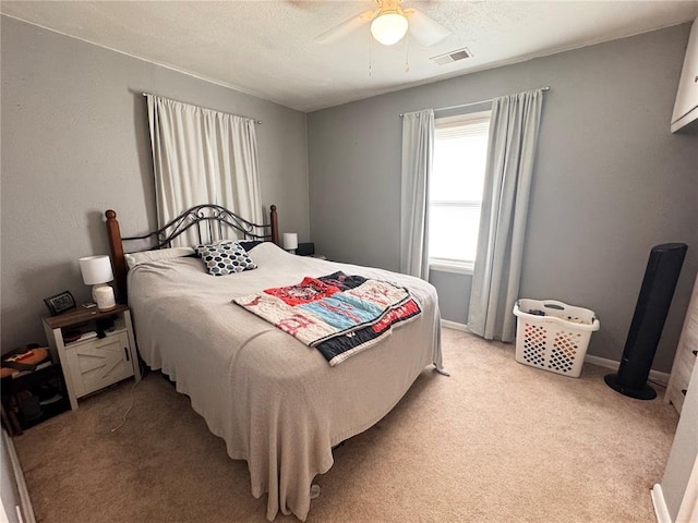 711 N Lindell St, Vandalia, MO 63382 - bedroom featuring light carpet, a ceiling fan, and a textured ceiling