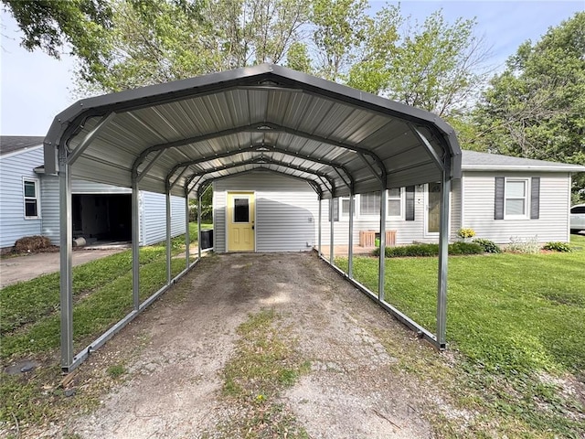 711 N Lindell St, Vandalia, MO 63382 - view of car parking featuring a detached carport