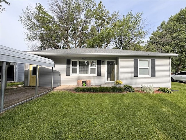 711 N Lindell St, Vandalia, MO 63382 - single story home with a front yard and a detached carport