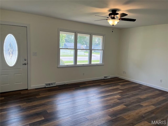1319 W Main St, Bowling Green, MO 63334 - foyer entrance featuring ceiling fan, dark wood-style floors, and baseboards