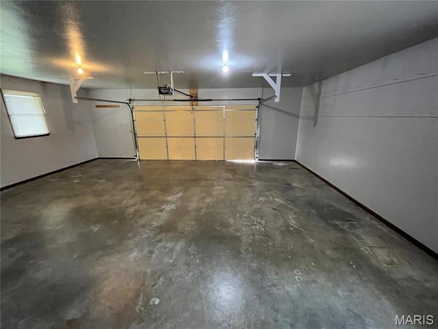 1319 W Main St, Bowling Green, MO 63334 - garage with a garage door opener and baseboards