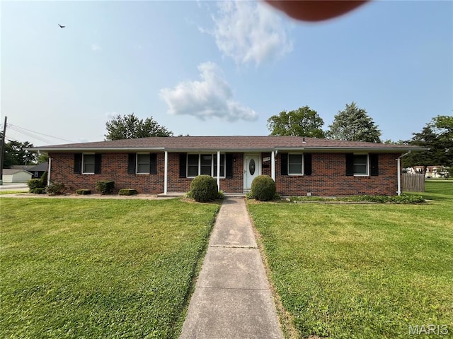 1319 W Main St, Bowling Green, MO 63334 - single story home with brick siding and a front yard