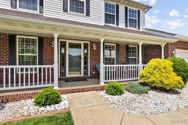 2711 Cascade Lake Dr, Shiloh, IL 62221 - property entrance with a porch and brick siding