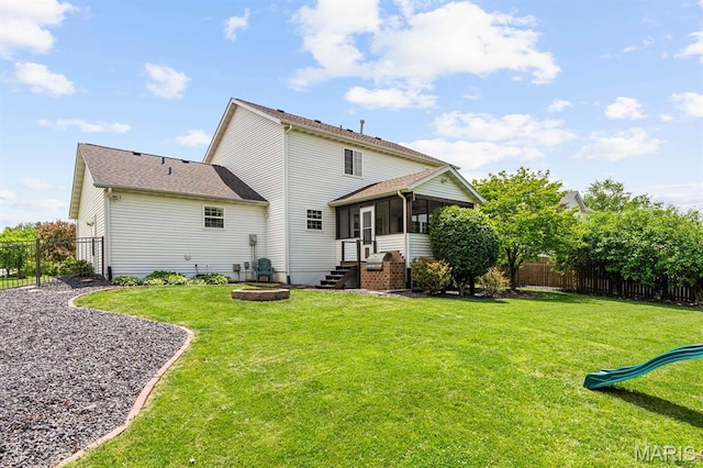 2711 Cascade Lake Dr, Shiloh, IL 62221 - rear view of house with a sunroom and a playground