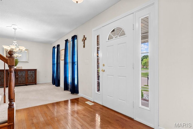 2711 Cascade Lake Dr, Shiloh, IL 62221 - entrance foyer with a chandelier, hardwood / wood-style floors, and baseboards