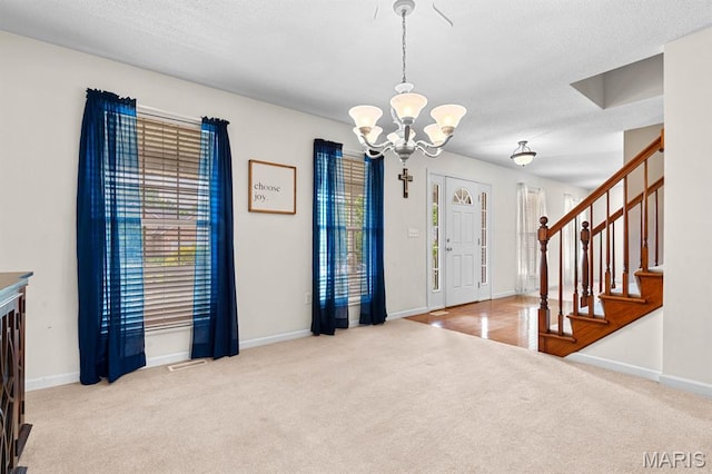 2711 Cascade Lake Dr, Shiloh, IL 62221 - entryway with carpet flooring, a chandelier, baseboards, and stairway