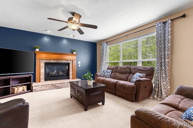 2711 Cascade Lake Dr, Shiloh, IL 62221 - living room featuring carpet flooring, a ceiling fan, a brick fireplace, and a textured ceiling