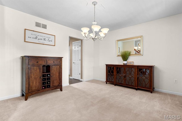 2711 Cascade Lake Dr, Shiloh, IL 62221 - carpeted dining space with a chandelier and baseboards