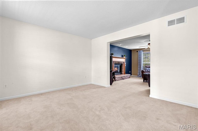 2711 Cascade Lake Dr, Shiloh, IL 62221 - unfurnished room with light colored carpet, a brick fireplace, baseboards, and ceiling fan