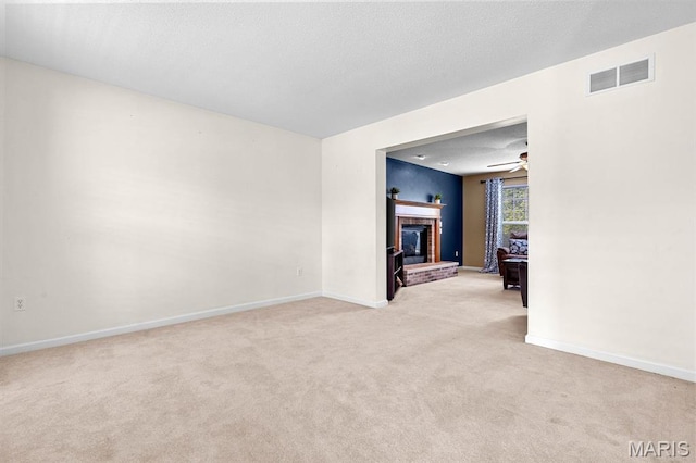 2711 Cascade Lake Dr, Shiloh, IL 62221 - spare room featuring light colored carpet, a fireplace, and baseboards